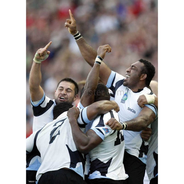Fiji's player celebrate
