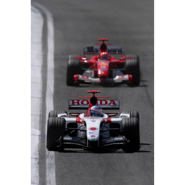 Jenson Button leads Michael Schumacher during the early stages of the San Marino Grand Prix at Imola | TotalPoster
