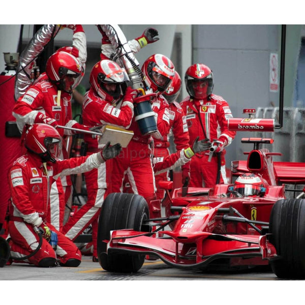 Kimi Raikkonen / Ferrari F1 makes a pit stop on his way to winning the Grand Prix of Malaysia | TotalPoster