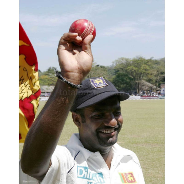 Muttiah Muralitharan celebrates becoming the all time wicket taker after victory in the cricket test between England and Sri Lanka | TotalPoster