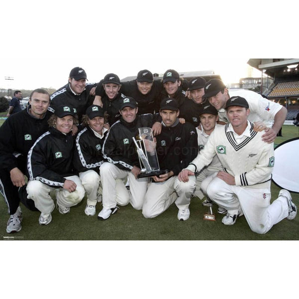 The New Zealand team pose with the trophy after beating England and drawing the series on the 5th day of the 3rd Test Match at Eden Park, Auckland | TotalPoster